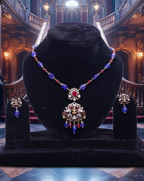 Blue and ruby bead chain with victorian polki ganesha pendant and matching drop earrings. Photographed at the shop.