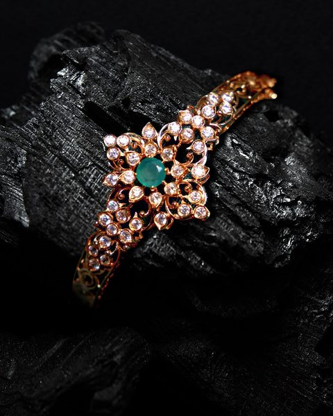Rose gold cz bracelet with green stone floral centre. Photographed at the shop.