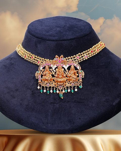 Gold bead choker with lakshmi ganesha saraswati pendant, kempu stones and pearl emerald drops. Photographed at the shop.