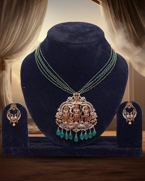 Ram parivar cz pendant on emerald bead strands with peacock earrings. Photographed at the shop.