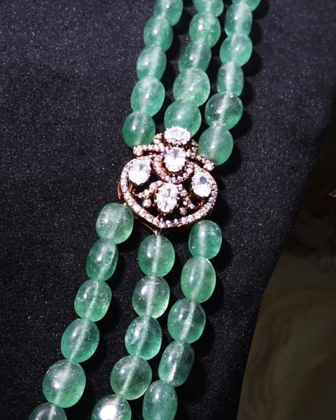 Three strand green bead mala detail with small CZ Victorian side clasp. Photographed at the shop.