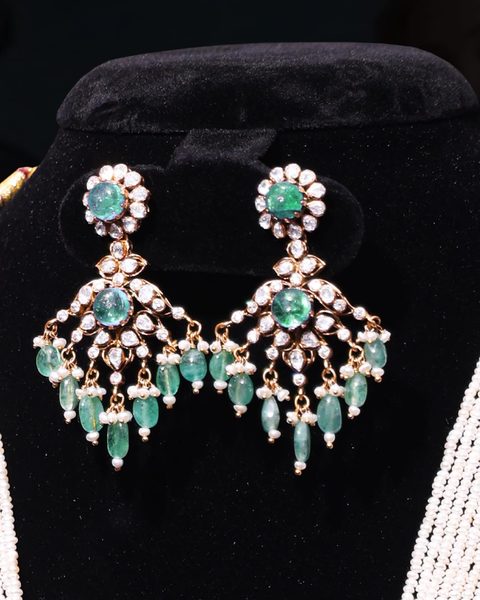 Pair of Victorian CZ chandelier earrings with emerald cabochons, pearl and emerald bead drops. Photographed at the shop.