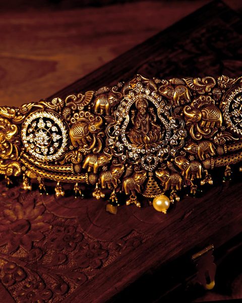 Antique nakshi hip chain with Lakshmi centre, elephants, CZ rosettes and pearl drops. Photographed at the shop.