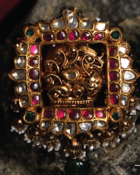 Square kempu pendant with gold swan centre, polki border, pearl fringe and emerald drop. Photographed at the shop.