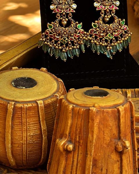 Nakshi chandbali earrings with lakshmi top, kempu polki stones and emerald bead drops. Photographed at the shop.