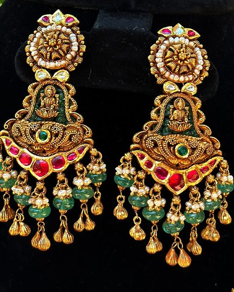 Antique lakshmi chandbali earrings with kempu band, emerald beads, pearls and gold drops. Photographed at the shop.