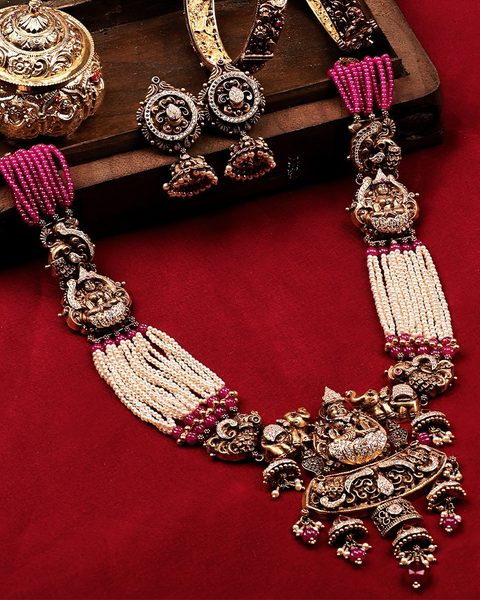 Nakshi haram with pearl and ruby bead strands, lakshmi and elephant pendant, kadas, jhumkas. Photographed at the shop.