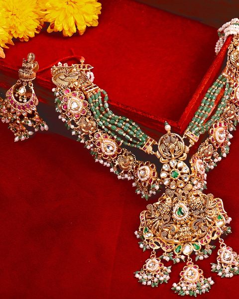 Nakshi haram with emerald bead strands, peacock clasps, lakshmi pendant and chandbali earrings. Photographed at the shop.