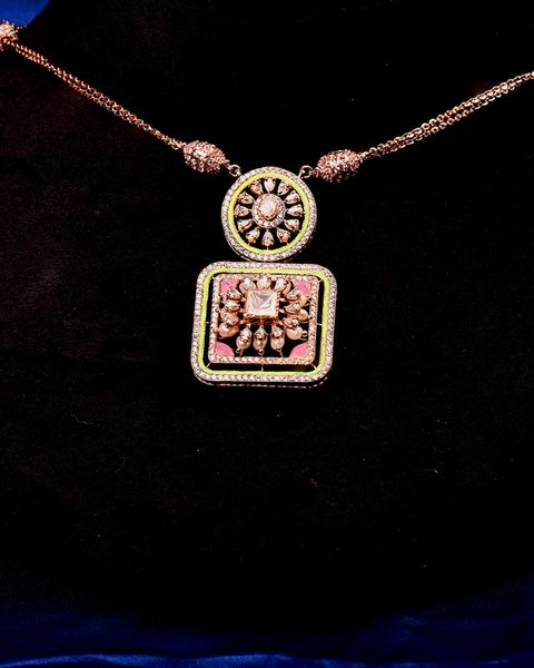 Rose gold cz necklace with round and square pendant, green enamel border, matching studs. Photographed at the shop.