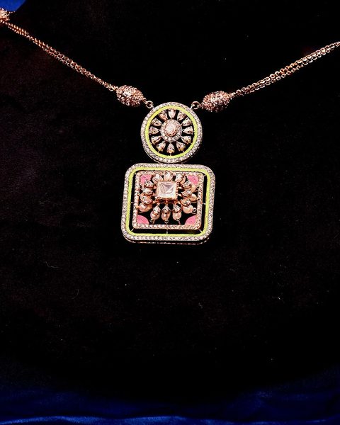 Rose gold cz necklace with round and square pendant, green enamel border, matching studs. Photographed at the shop.