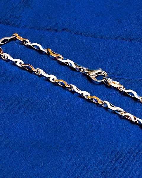 Two tone platinum and rose link chain with lobster clasp. Photographed at the shop.