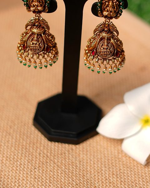 Antique lakshmi jhumkas with green bead rim and pearl drops. Photographed at the shop.