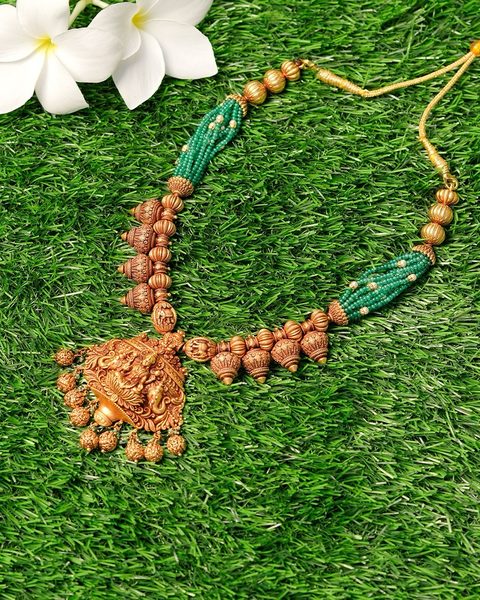 Nakshi haram with lakshmi pendant, gold beads and emerald bead strands. Photographed at the shop.