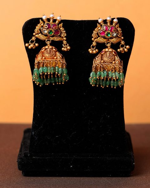 Nakshi jhumka pair with lakshmi bell, kempu flower top and emerald bead drops. Photographed at the shop.