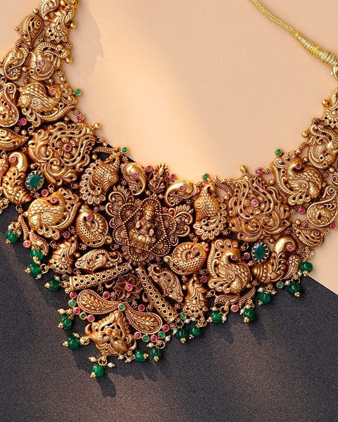Nakshi choker with lakshmi centre, peacock and mango panels, emerald bead drops. Photographed at the shop.