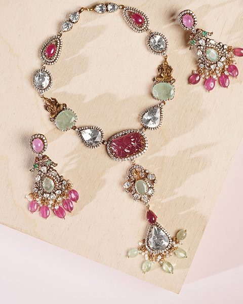 Victorian polki necklace with carved ruby centre, green stones, ruby bead drops and earrings. Photographed at the shop.