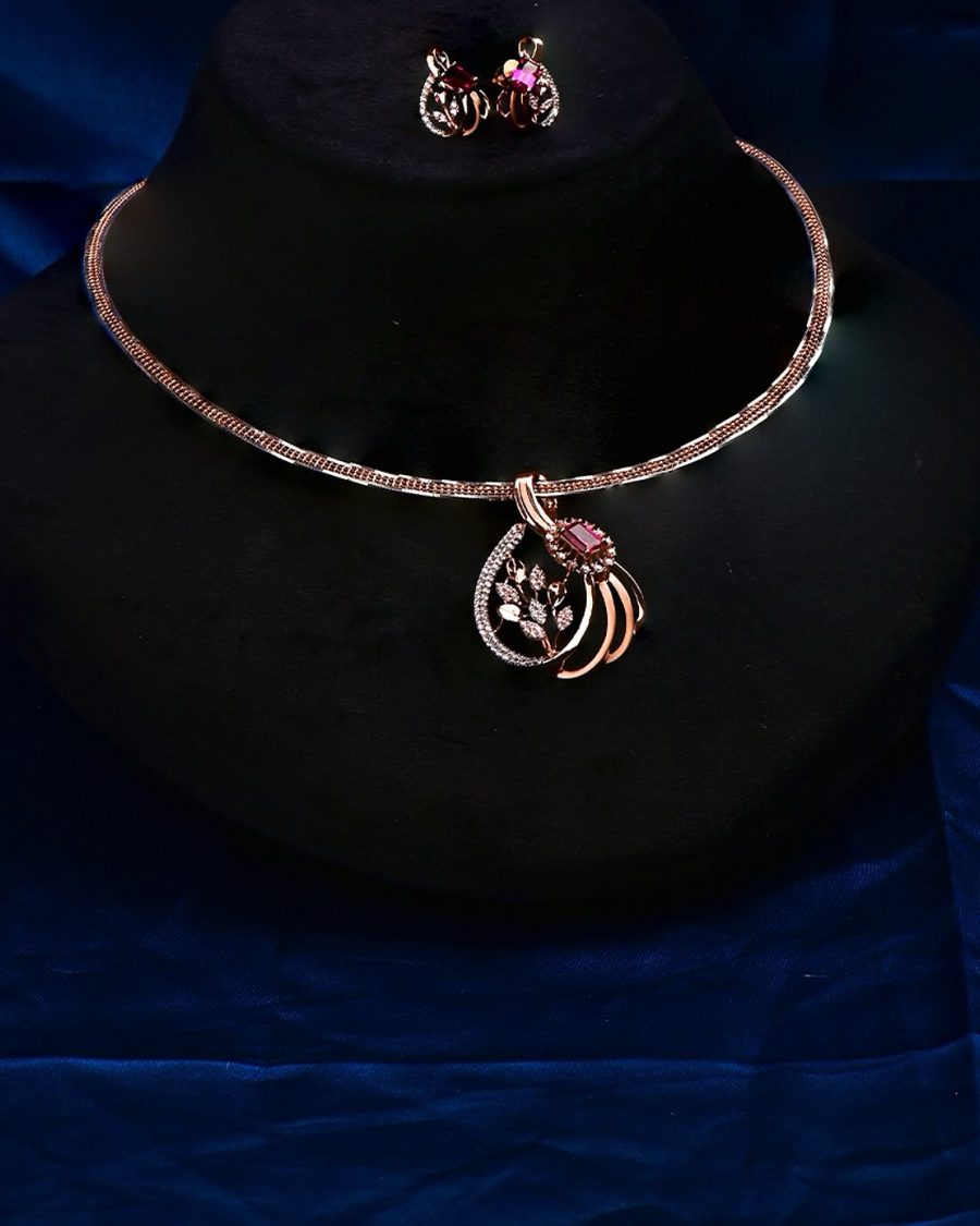 Diamond jewellery photographed on a dark ground.